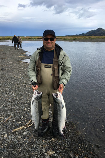 Abraham Kololli fishes for salmon in the American River at Kodiak Island in Alaska.