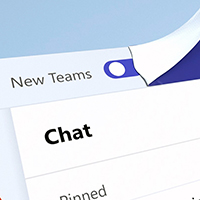 A Microsoft Teams chat window. At the top, a sticker is peeled away, revealing a toggle switch next to the words New Teams. (Courtesy of Microsoft)