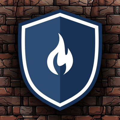 A white flame on a blue shield, outlined in white and then blue, on a brick wall.