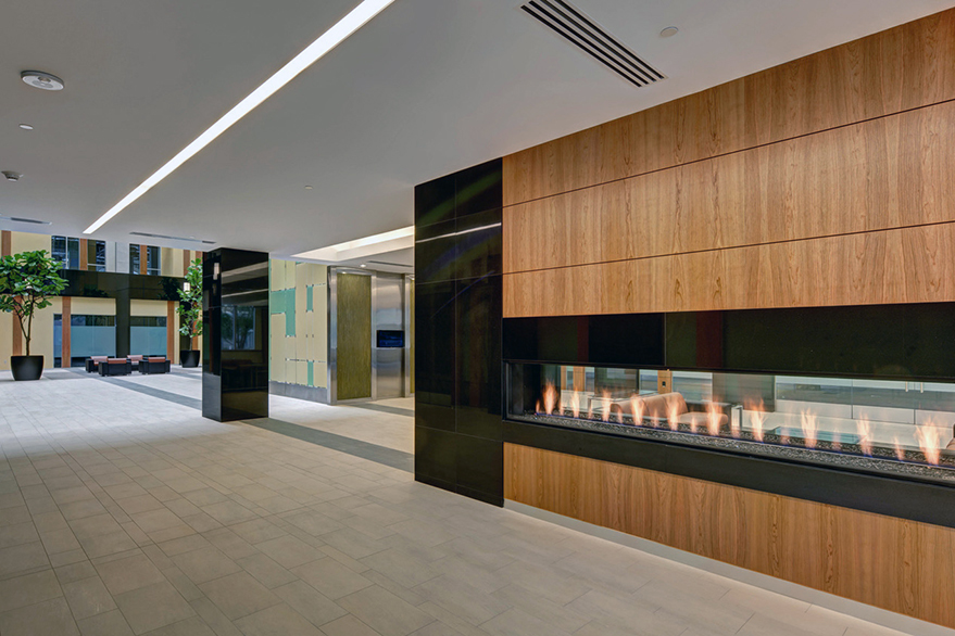 The 102 Tower lobby features a gas fireplace and two sitting areas.