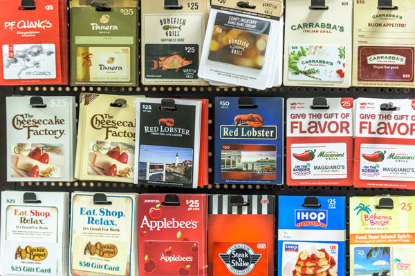 A rack of gift cards to various restaurants.