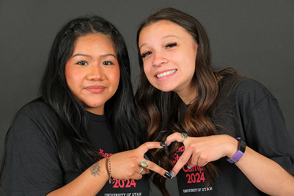 Two students embrace for a photo at the 2024 Indigenous Storytelling Camp. (Photo courtesy of Tony Sams, University of Utah)