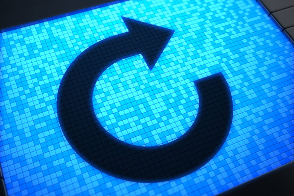 A black restart icon on top of a rectangle made up of dozens of squares of various shades of blue, rotated slightly to the left.