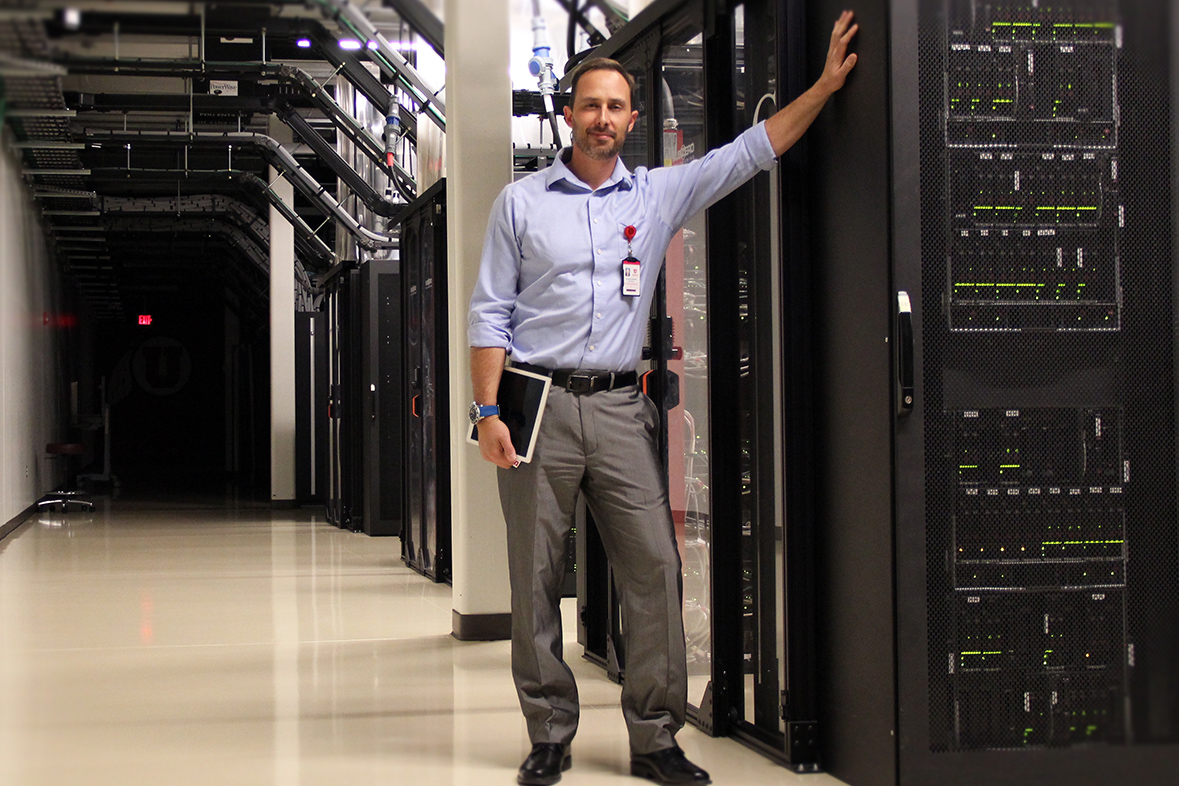 Chris Pedersen, operations specialist at the University of Utah's Downtown Data Center, stands inside the DDC's main production area on October 18, 2018.