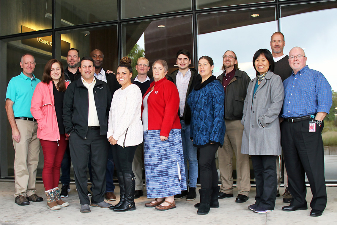 L-R: Erik Hjorten, Lyndi Duff, Chris Hoffman, Jon Thomas, Daniel Gowon, Jasmine Harris, Nate Sanders, Rebekah Grow, Emerson Pratt, Amanda Babcock, Cory Stokes, Qin Li, Stan Clements, and Paul Burrows. Not pictured: Cecile Paskett, Jeffery Hullinger, and support staff members Cindy Hanson and Jeanne Krogen.