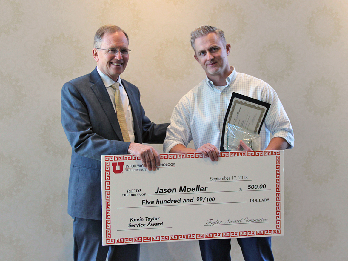 L-R: CIO Steve Hess congratulates Jason Moeller, of University Support Services, winner of the 2018-19 Kevin Service Taylor Award