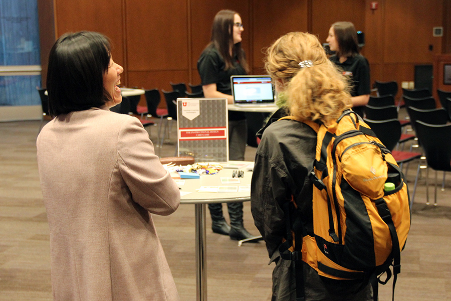 Senior Instructional Designer Qin Li, left, shares a laugh during the Fall Faculty Forum event on October 15 at the Marriott Library.