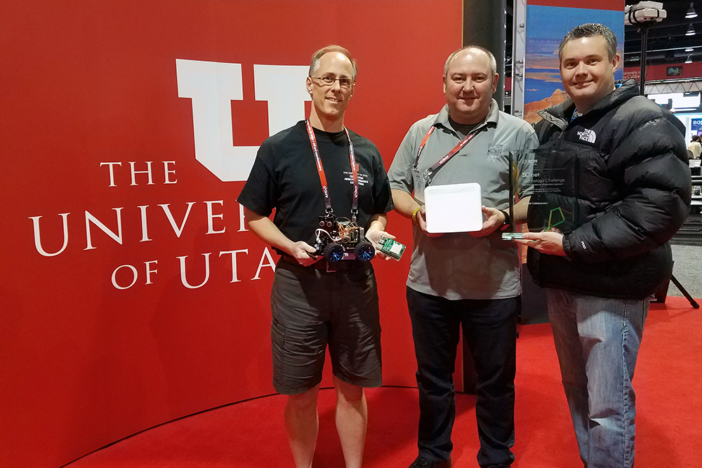 CHPC's Joe Breen, from left, and Murray City School District's Jason Eyre and Kraig Fisher won the Best Presentation & Visualization Approach award in the SCinet Technology Challenge. (Courtesy of Anita Orendt)