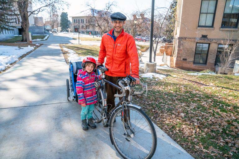 Martin Cuma, Ph.D., a computational scientist in UIT's Center for High Performance Computing and avid cyclist, is pictured with his daughter. Cuma was recently featured in Humans of the U. Image courtesy of the University of Utah.