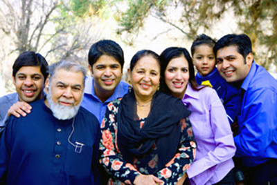 L-R: Amir's brother Sana, father Masood, brother Umair, mother Zeenat, wife Kinza, son Ashar, and Amir.  Not pictured: sister Imrana and brother Asim.