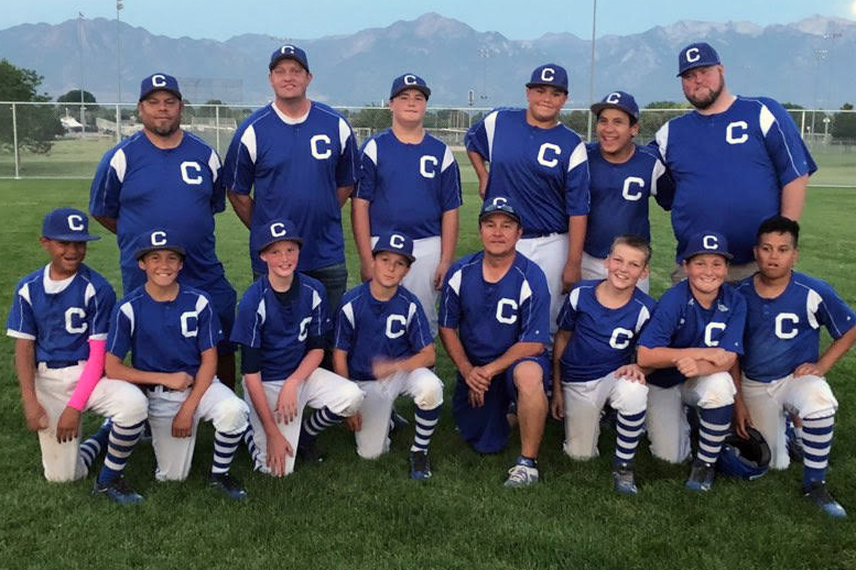 Johnson — back row, far left — helps coach the Pirates youth baseball team. 2020 will be his last year coaching.