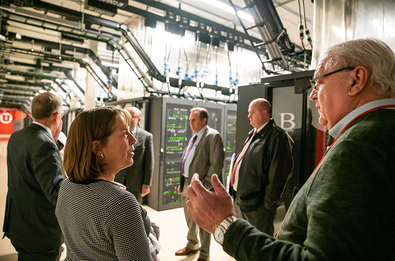 Glen Cameron speaks to Chief Financial Officer Cathy Anderson, left, in February 2019 during a tour of the Downtown Data Center. 