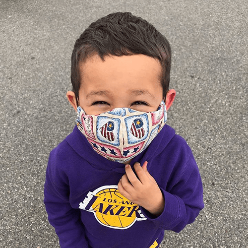 Jan Lovett's grandson, Max, models a mask that she made. (Courtesy of Jan Lovett)