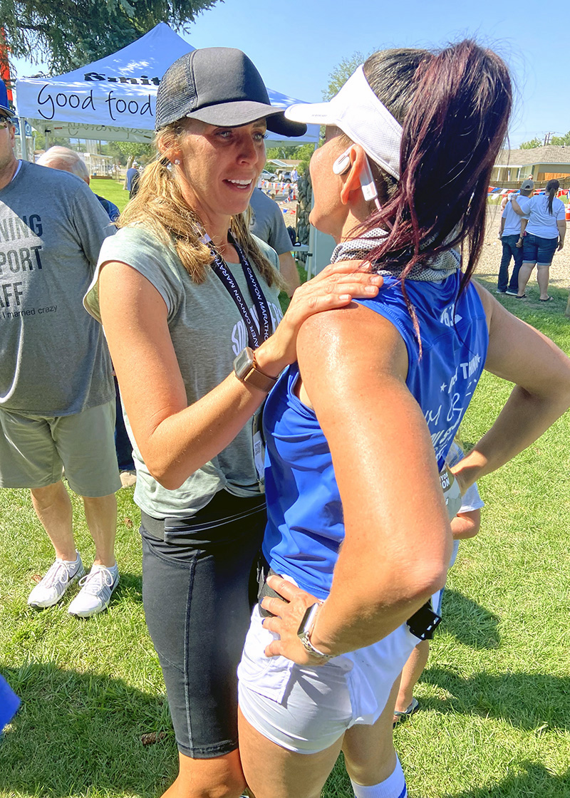 L-R: Sisters Sarah Bradshaw and Becca Albrecht congratulate each other after finishing the Beaver Canyon marathon on August 14.