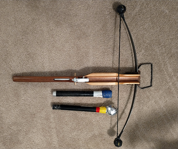 Shown above are Sageser's crossbow and two types of bolts he uses during SCA events. The one on the bottom has a tennis ball head, and the other has a closed cell foam tip. Both feature hollow shafts.