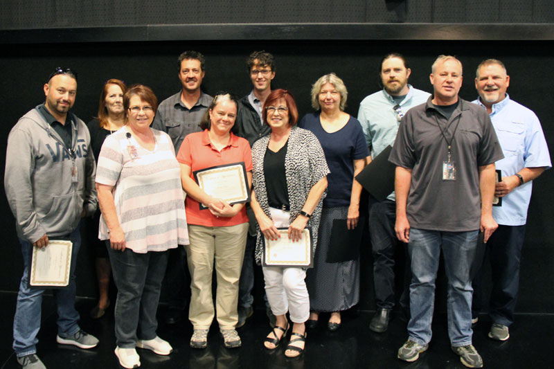  At the 2019 UIT All-Hands Meeting, Jill Brinton (center back) was honored for 20 years of service. Fellow honorees include Jason Lawes (from left), Camille Wintch, Julia Harrison, Shay Frank, Shellie Eide, Robert Curtis, Jan Lovett, CJ McMillan, Brad Zumbrunnen, and Marc Thompson.
