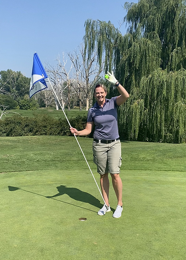 Sharia Mindrum celebrates her hole-in-one on hole No. 8 at Forest Dale Golf Course. 