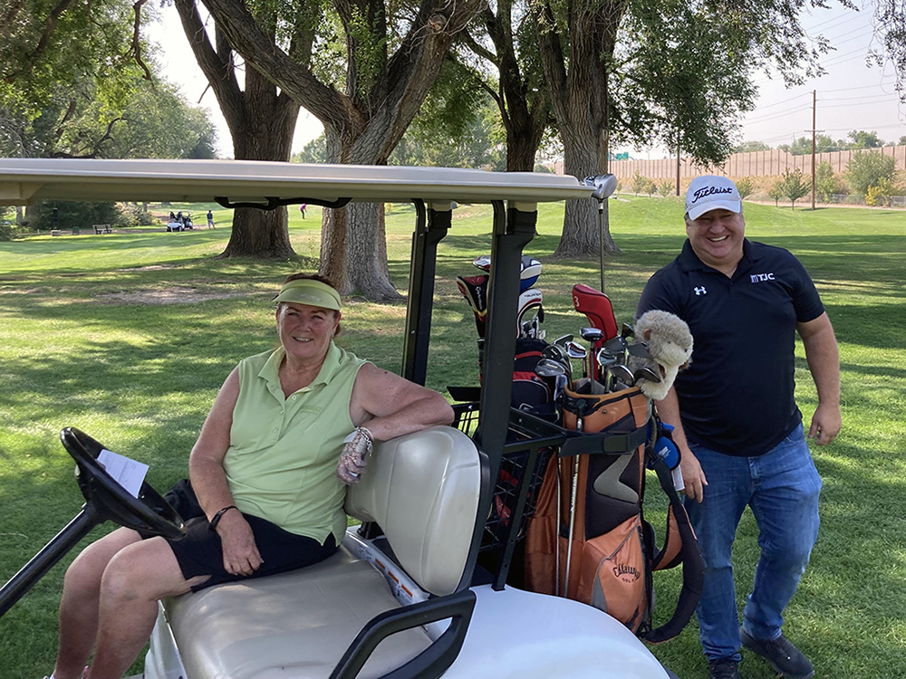 L-R: Camille Wintch, longtime golf tournament organizer who has since retired from UIT, and former UIT employee Jeff Hassett.