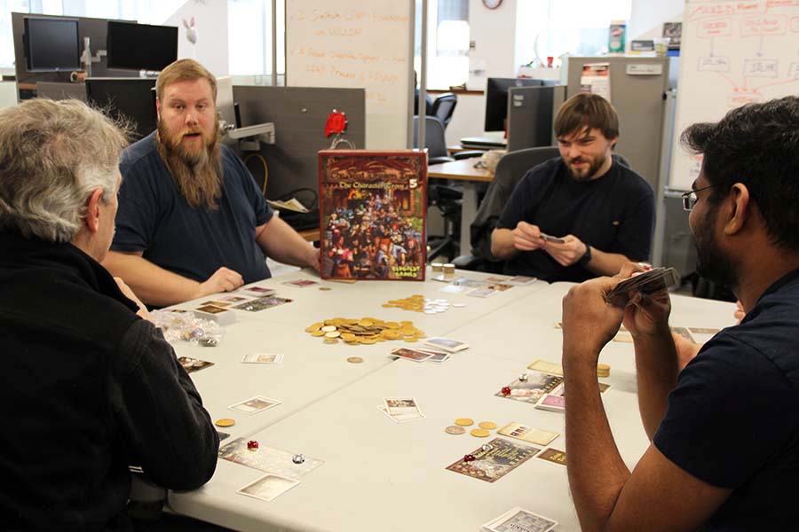 USS staff members play the Red Dragon Inn card game.