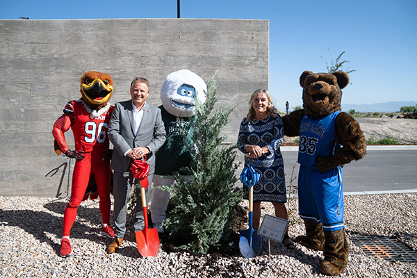 L-R: U mascot Swoop, U President Taylor Randall, the Herriman Yeti, SLCC President Deneese Huftalin, and SLCC mascot Brutus plant a Juniper tree during a ribbon-joining ceremony on August 7 at the Juniper Building. Image courtesy of the University of Utah.