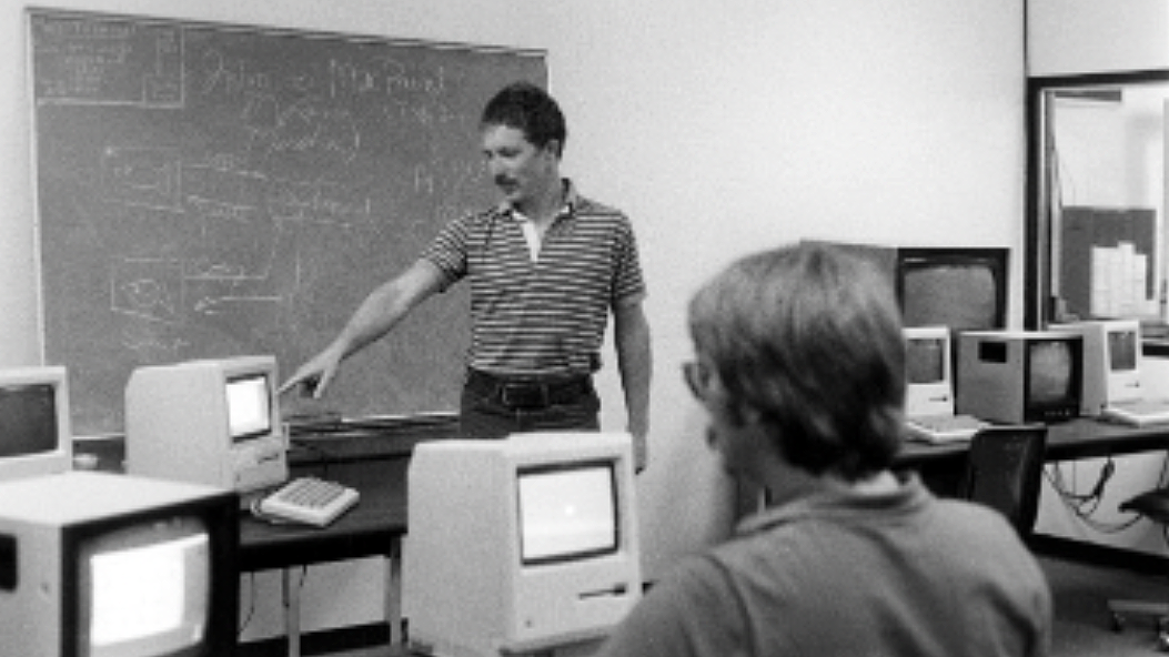 Dave Huth, left, instructs at the Macintosh teaching lab (MacLab) in 1984.