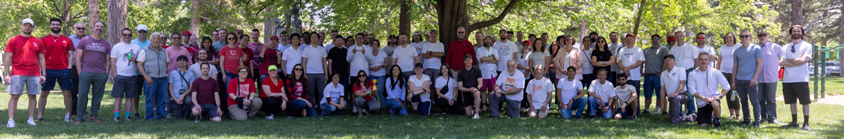 Employees from UIT's Deputy Chief Information Officer organization and Software Platform Services team pose on May 18, 2023, for a group photo at Liberty Park, where they met for the DCIO-SPS Olympic Games. Photos by Thanh Nguyen. 