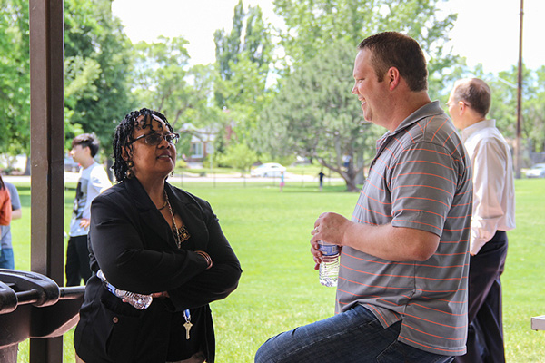 Syndi Haywood, left, and Curtis Larsen chat during the 2015 UIT and ITP summer picnic.