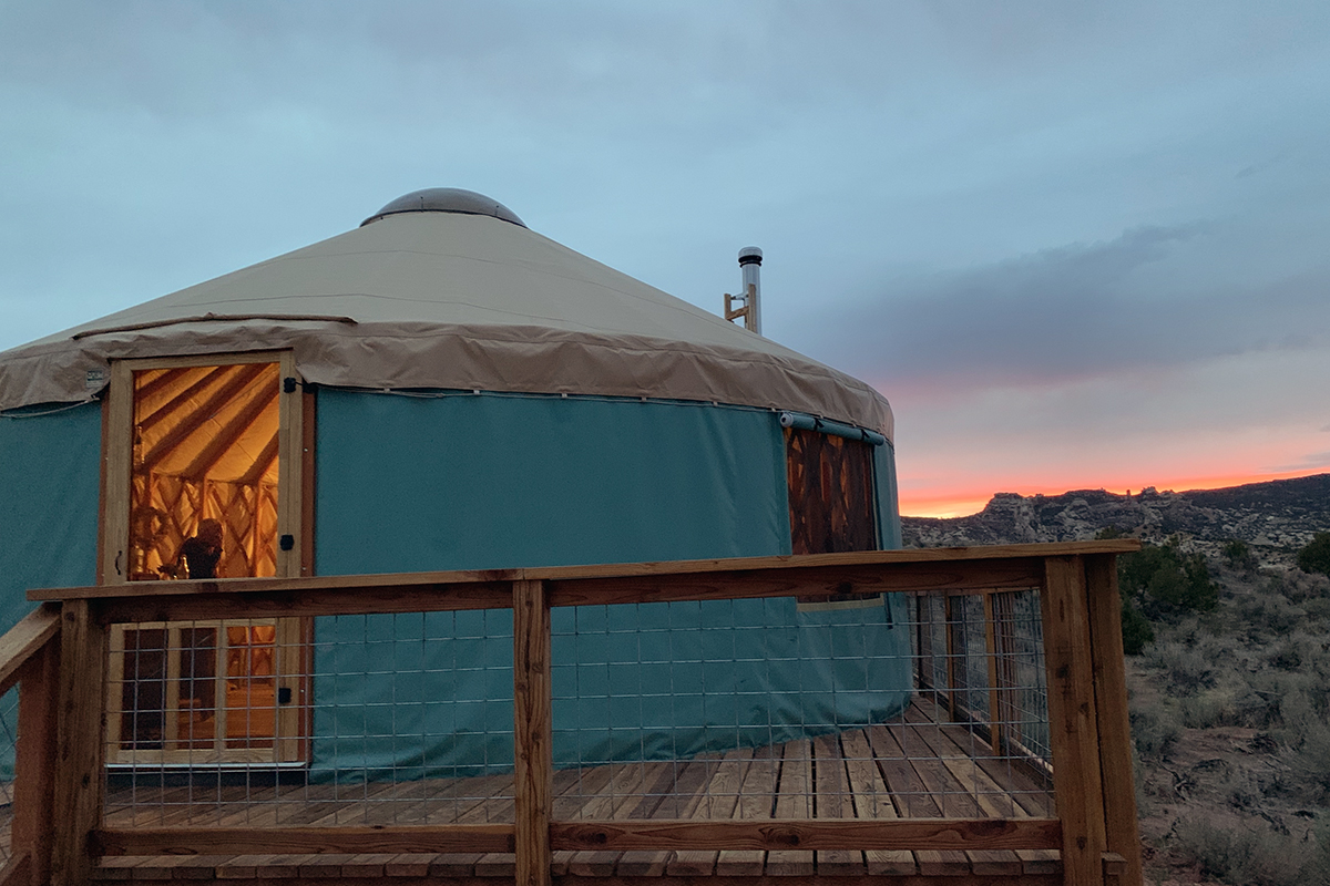      Earl Lewis' yurt in Vernal, Utah, at dusk. The yurt sits atop a 30-square-foot deck his daughter helped him construct.
