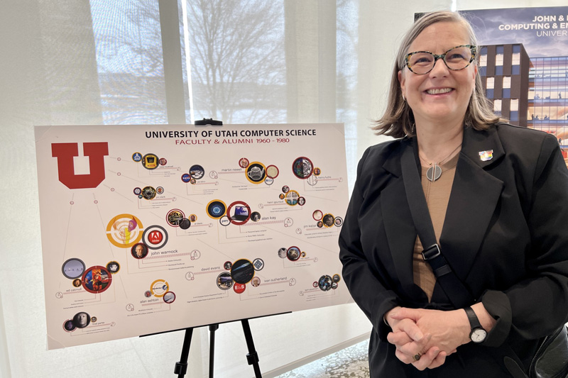 Johnson attends the 50th anniversary celebration of computing at the University of Utah, where a poster created by her former student Marianne Hussey was on display.