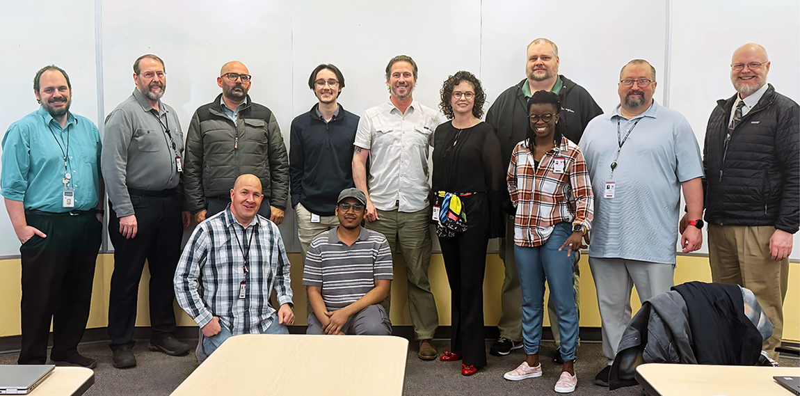 Standing, from left: Brad Avery, Lewis Hofmann, Rebwar Baesmat, Dylan Russel, Gabe Mickel, Kelly Tappenden, Kelly Marosok, Amen Koutowogbe, Jason Genovesi, and Clay Postma; kneeling, from left: Cody Rasmussen and Muazzamfaraaz Mohammed.