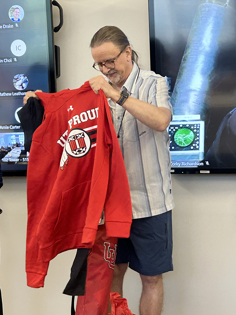 Jon Ross accepts some U-branded parting gifts.