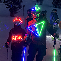 Brian Harris and his son during a torchlight parade at Alta ski area