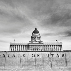 A black and white image of the Utah State Capitol.
