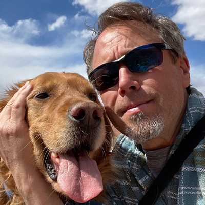 Tony Sams, a manager for Learning Experience in Digital Learning Technologies, with his dog Harley.