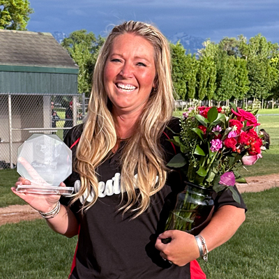 Heather Birky Winters received a crystal award and flowers for her long-standing volunteer work with Rose Park/West Side Baseball from the board of the Little League on June 3, 2024, at Riverside Park. (Photo by Larrisa Beth Turner)