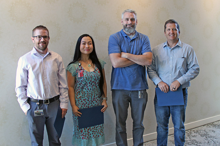 L-R: Brian Harris, Tina Nguyen, Colby Gray, and Brad Grow were honored for 10 years of service to UIT during the September 17 All-Hands Meeting at the Alumni House. Not pictured: Amy Talbot.