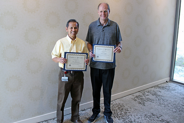 L-R: Ray Lacanienta and Dave Griffin were honored for 30 years of service to UIT during the September 17 All-Hands Meeting at the Alumni House.