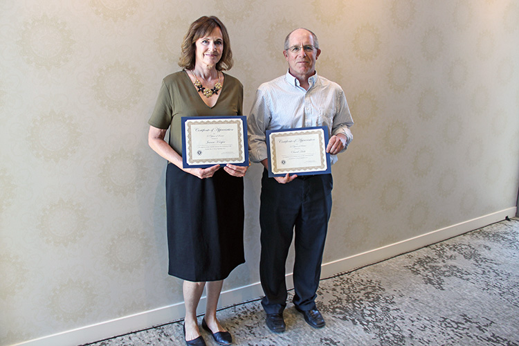 L-R: Jeanne Krogen and Dave Huth were honored for 35 years of service to UIT during the September 17 All-Hands Meeting at the Alumni House.