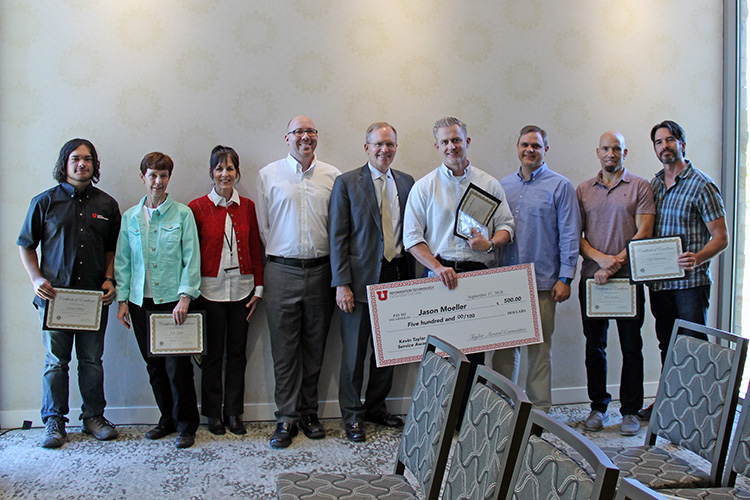 L-R: Kevin Taylor Memorial Service Award nominees Danial Ebling, Judy Yeates, Robin Horton, and Chris Moore, pose with CIO Steve Hess and award winner Jason Moeller, as well as fellow nominees Rob Lake, Matt Leatham, and Rob Birkinshaw pose for a photo at the September 17 All-Hands Meeting at the Alumni House.