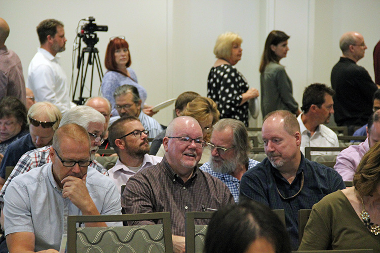 UIT employees socialize before the All-Hands Meeting on September 17 at the Alumni House.