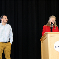 Vice President for Student Affairs Lori McDonald presents the Campus Partners Award to Associate Director for Business Intelligence Tom Howa.