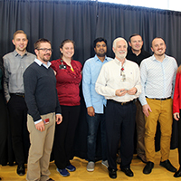 Special Assistant for Strategic Initiatives Stacy Ackerlind, from left, Dane Luby, Brian Harris, Susan Schaefer, Jawahir Ahamedkasim, Bryan Harman, Deputy CIO Ken Pink, Associate Director for Business Intelligence Tom Howa, and Vice President for Student Affairs Lori McDonald take a photo on December 10, 2019, during the Student Affairs winter luncheon, where the Business Intelligence team received the Campus Partner Award.