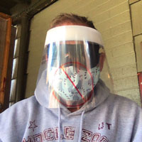 Marc Thompson, wearing a fask mask and shield, wrote "My shield is on mute. So, three masks and Marc's on mute..."