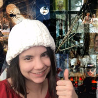 Kelsey Loizos gives a thumb up in front of her Jason Moeller-themed Halloween Zoom background.