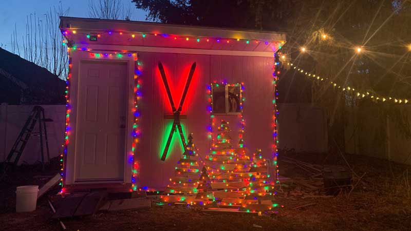 Brian Harris added a lot of lights to his shed, including red and green ones behind the skis mounted to the exterior wall.