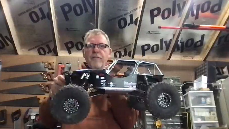 Marc Thompson with one of his RC cars in his "ShedMarc."