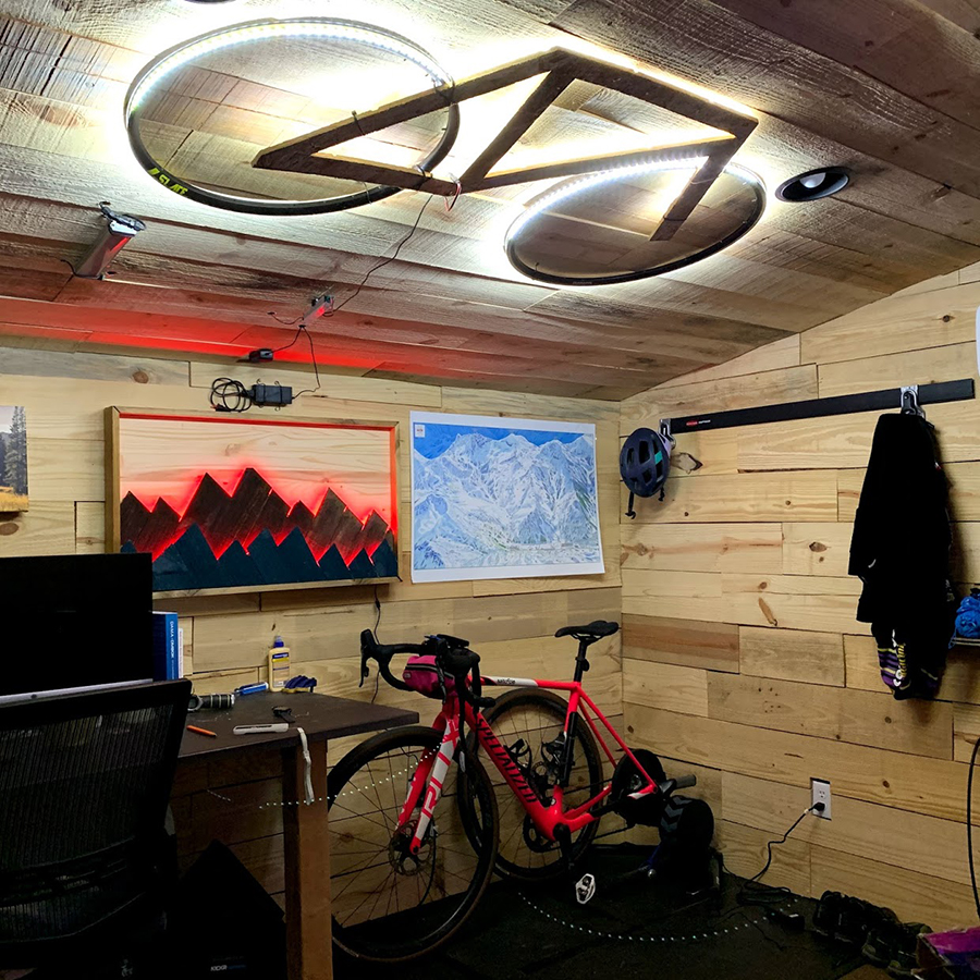 The centerpiece of Harris' home office — a bicycle-shaped light fixture with recycled rims mounted on the ceiling.