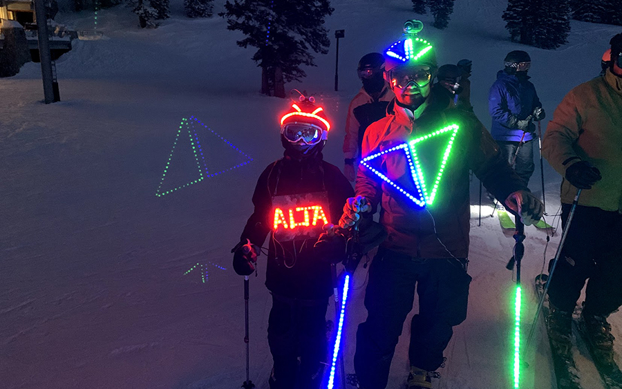 At a torchlight parade at Alta ski area, Harris dressed up in Snowbird ski resort colors with poles to match and his son went as Alta.