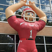 A giant inflatable Ute football player