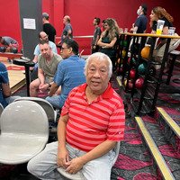 Ed Fresco sits while UIT employees bowl September 1, 2022, at the A. Ray Olpin Union bowling alley.